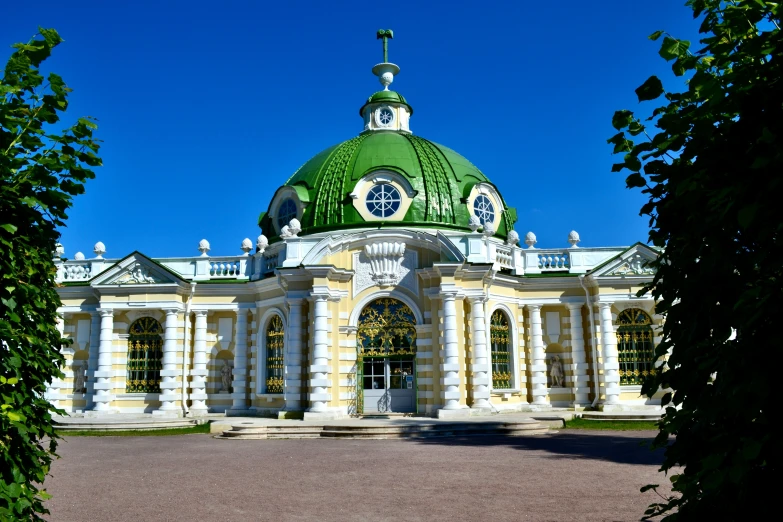 a large green dome on top of a large building