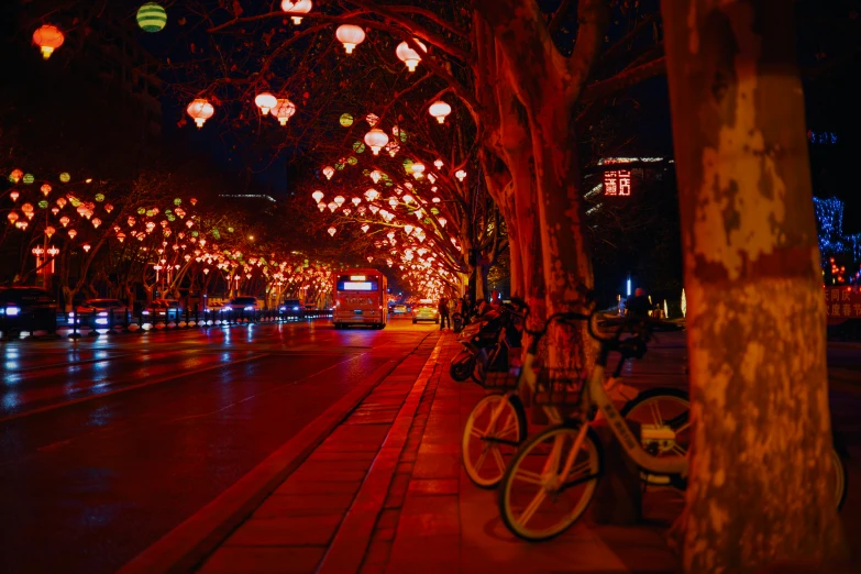 a lighted city street at night with bright lights