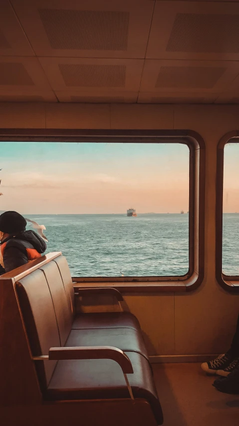 the view of the ocean out of a window on a ship