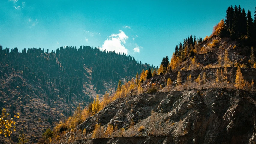 a large cliff sitting beneath a blue sky