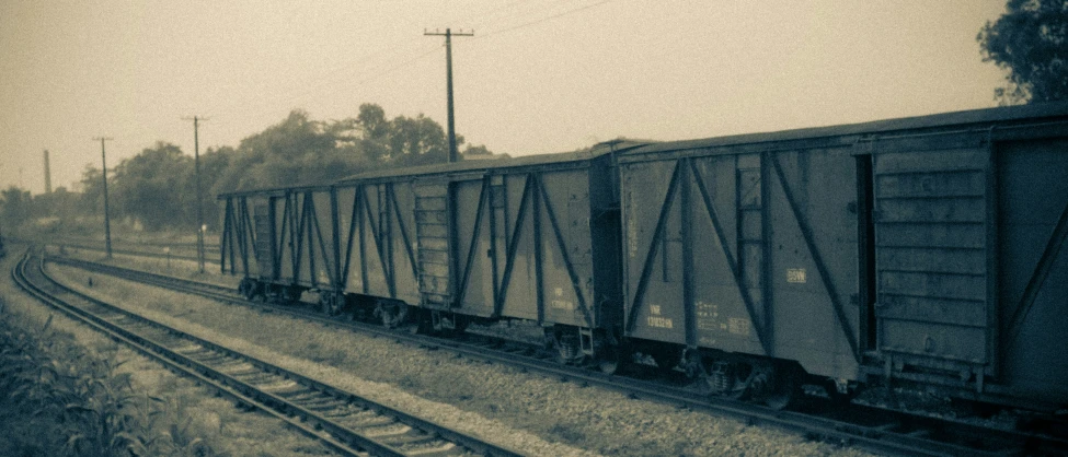 an old train is sitting on the train tracks