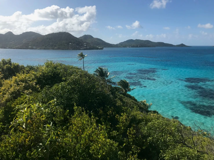 several small island in the ocean near the shore