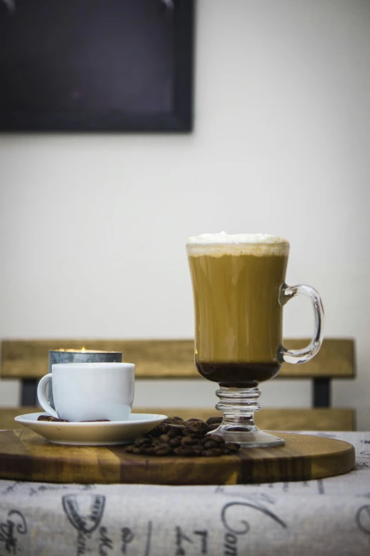 a coffee cup and saucer sit on a table