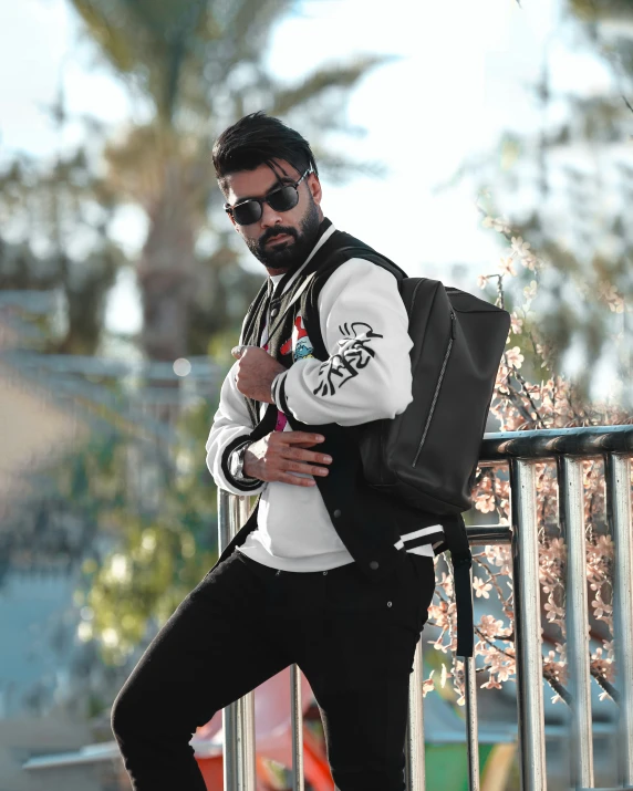 a man is standing on the edge of a railing