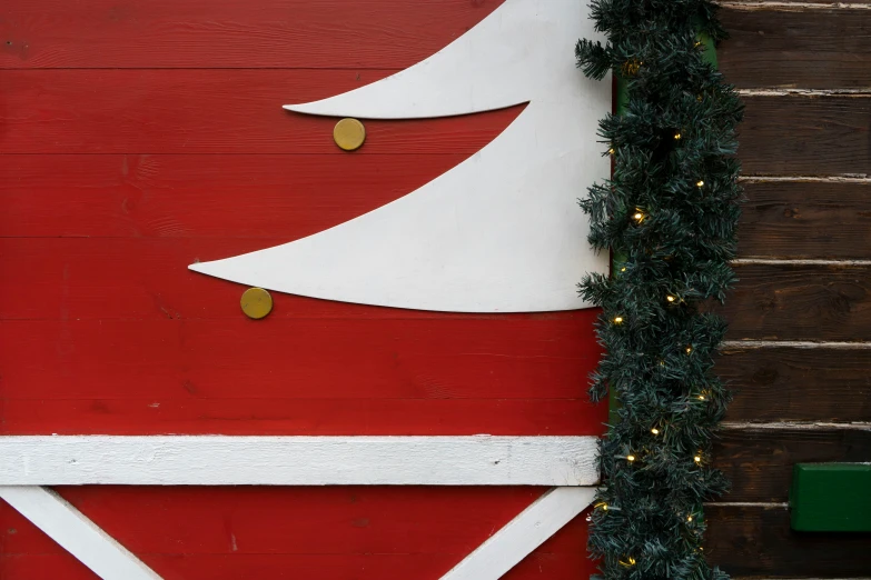 a christmas tree on the side of a building