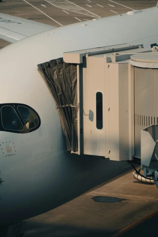 an airplane is parked and showing the door open