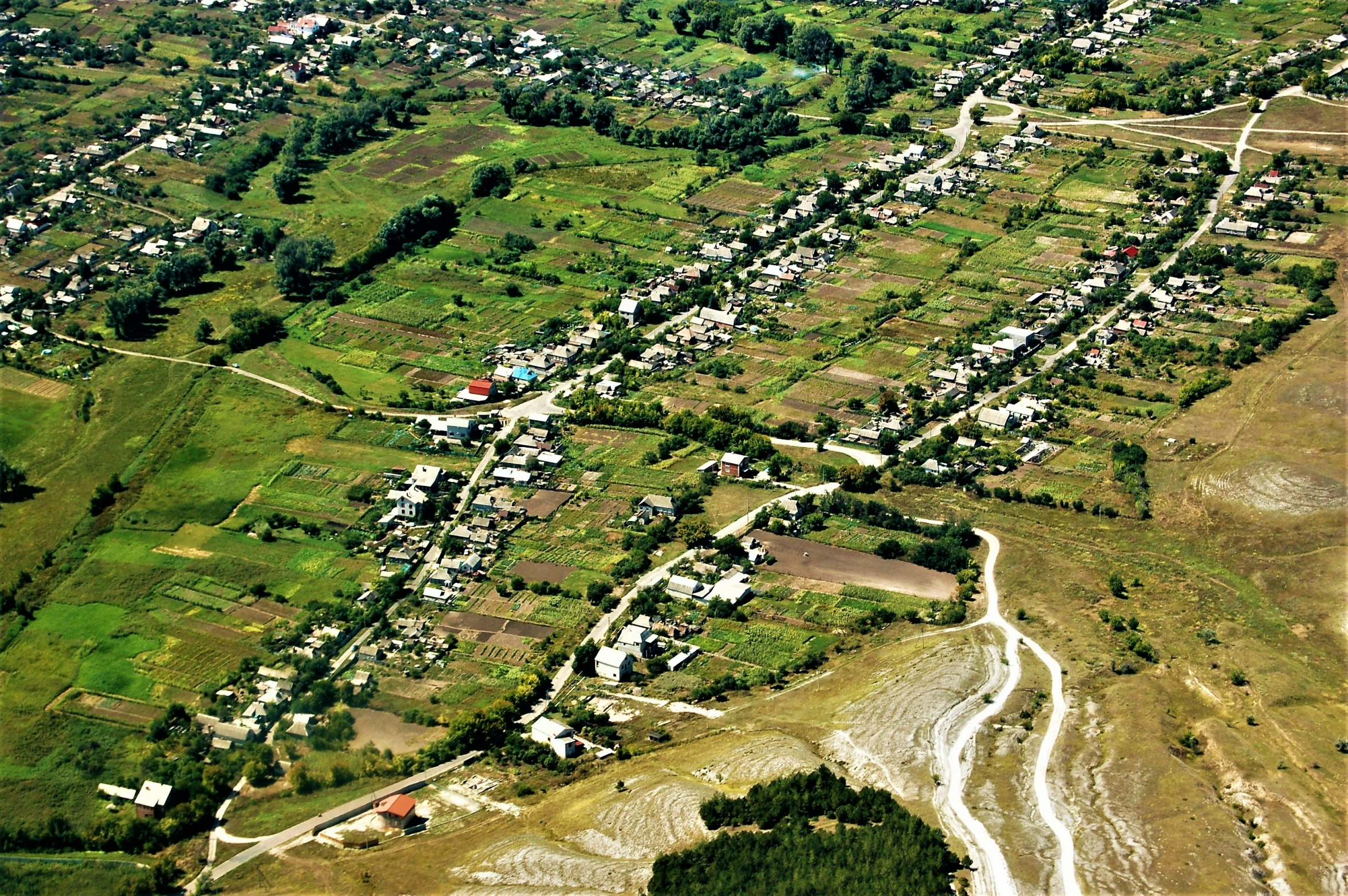 an aerial view of a large area, with many houses