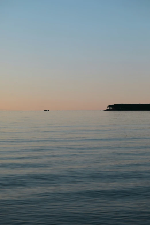 the light house in the distance looks like a floating island