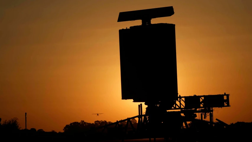 a silhouetted s of an empty sign tower