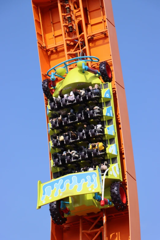 a large vehicle hanging from the side of a structure