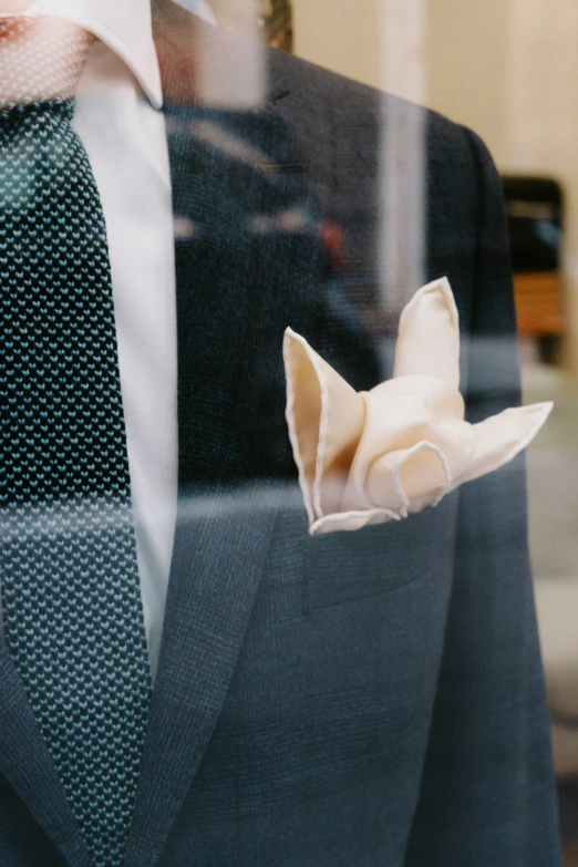 a man standing up holding soing with his tie up