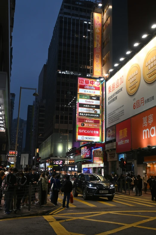 people are walking around a busy city street