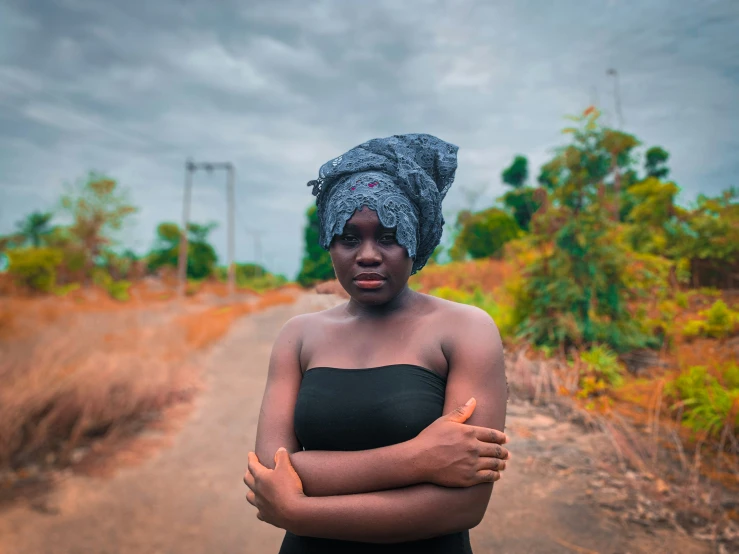 a woman in a turban poses for a po