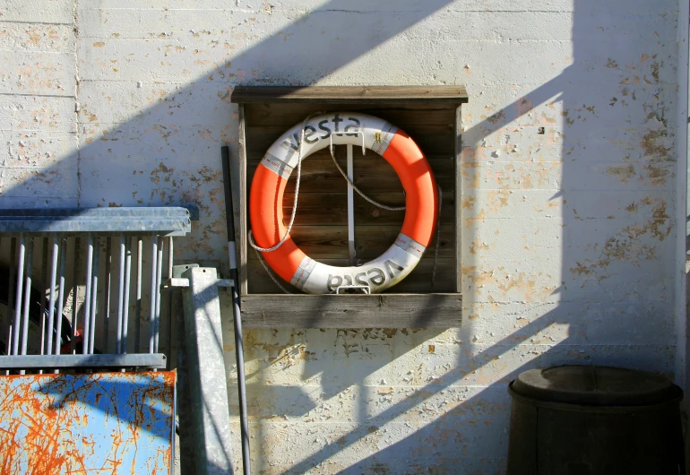 a life preserver that is sitting on top of a wall