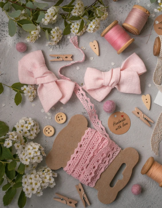 a bouquet of flowers is placed next to sewing supplies