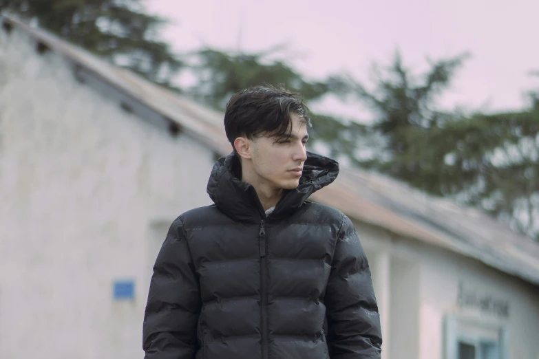 a man that is standing near a building