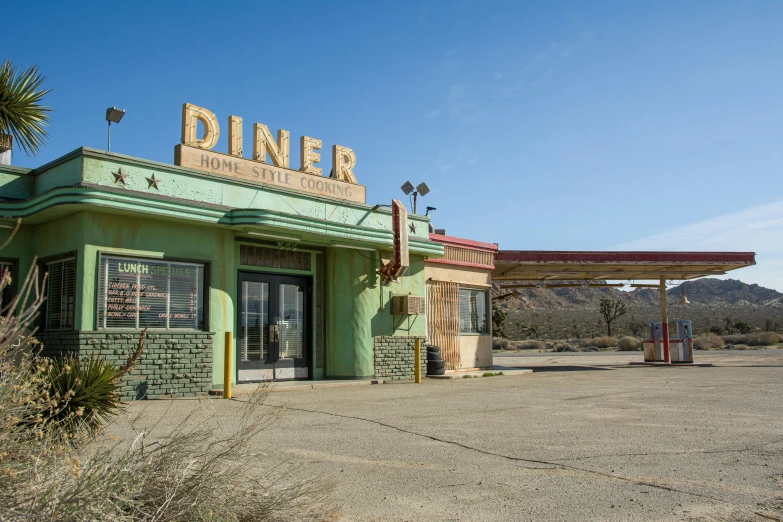 an old diner is shown in the desert