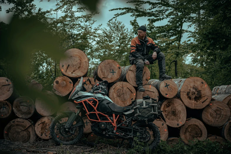 a person sits on top of a motorcycle