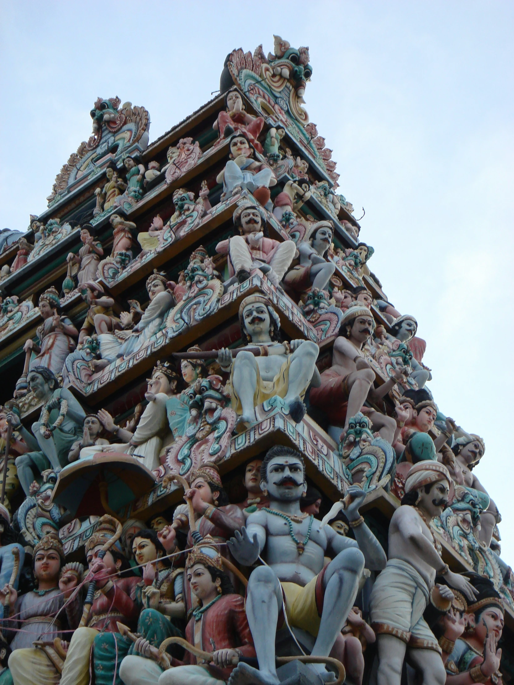 a very tall intricately decorated building with statues on it