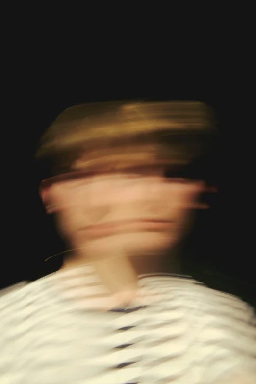 blurry picture of a person playing with a baseball