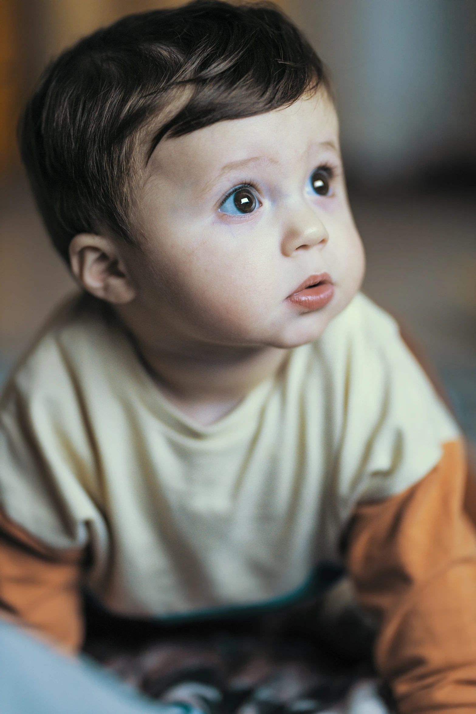 a  wearing a yellow shirt laying down