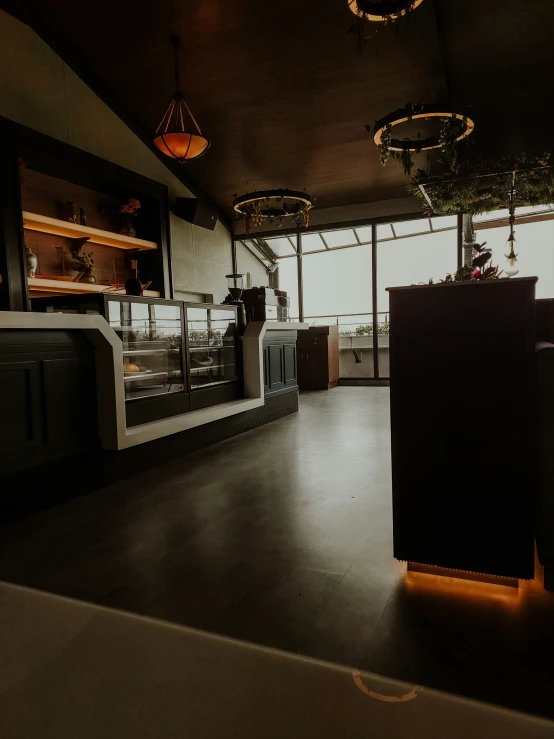 a restaurant is lit up by sunlight coming through the window