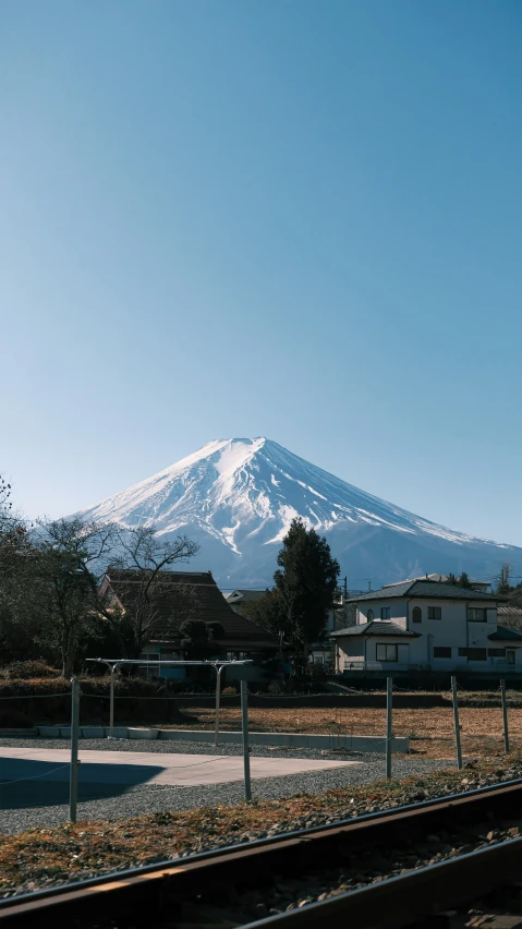 a mountain with no leaves is covered in a snow