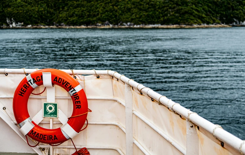 a boat is moving along the blue water