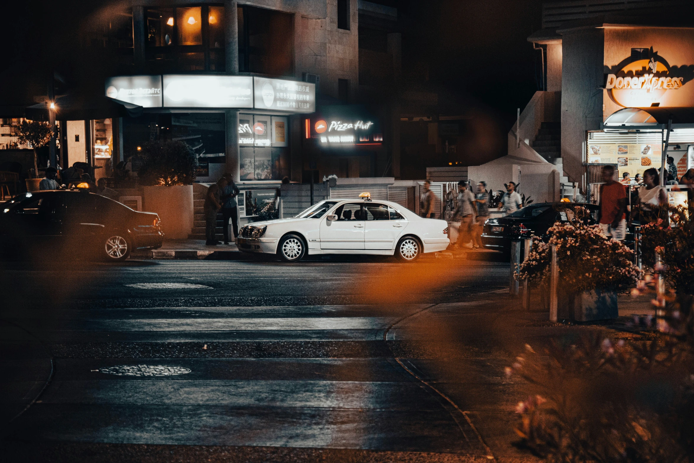 a car is waiting at a traffic light on a street