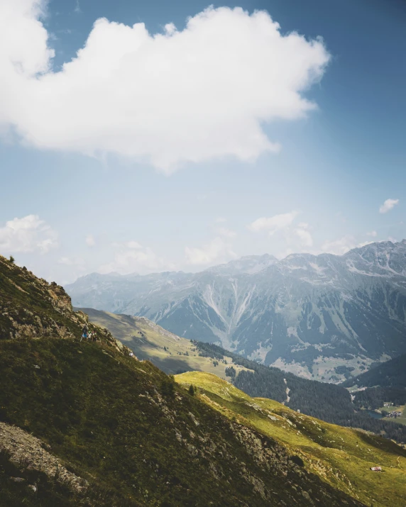 a very big beautiful view from a grassy hill