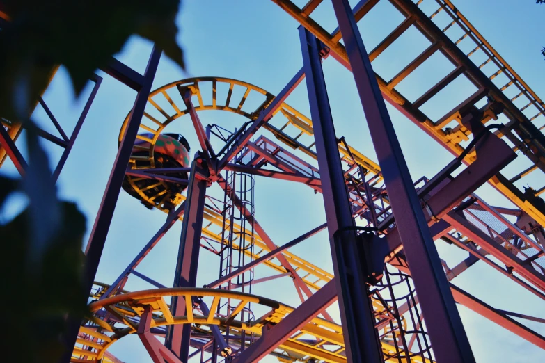 the roller coaster has a big clock displayed on it