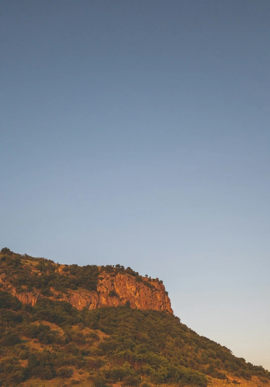 the mountains with a full moon and some trees