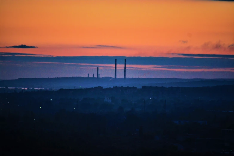 a view of a sunset over a hill