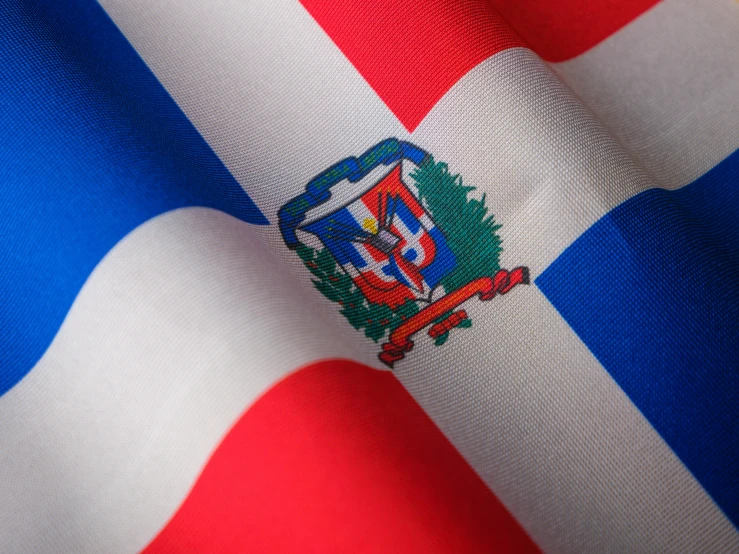 a red white and blue flag with a capital
