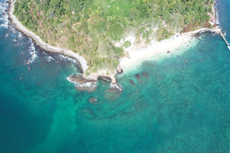 an aerial view of the ocean and a beach