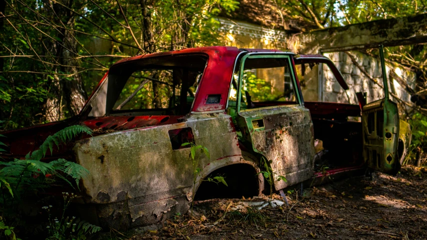 an old pick up truck sitting in the woods