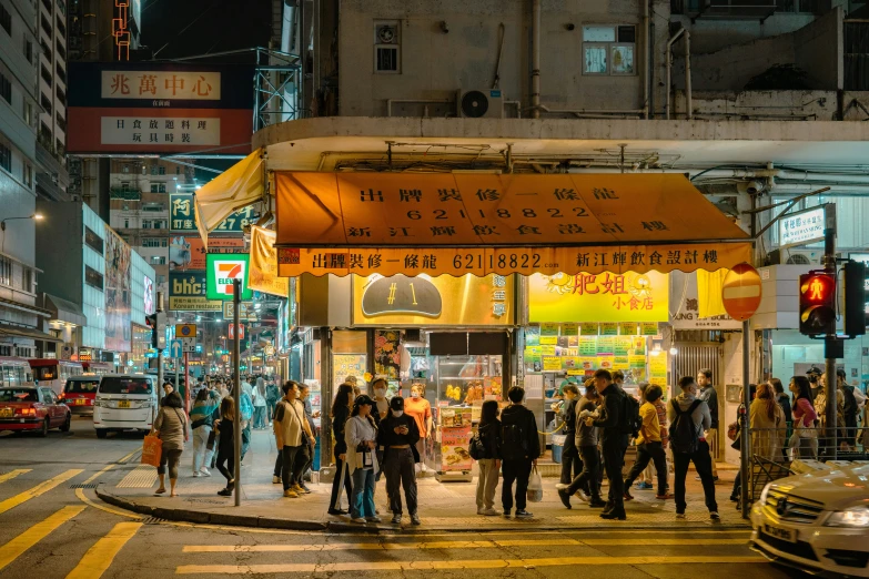 many people are walking on a city street