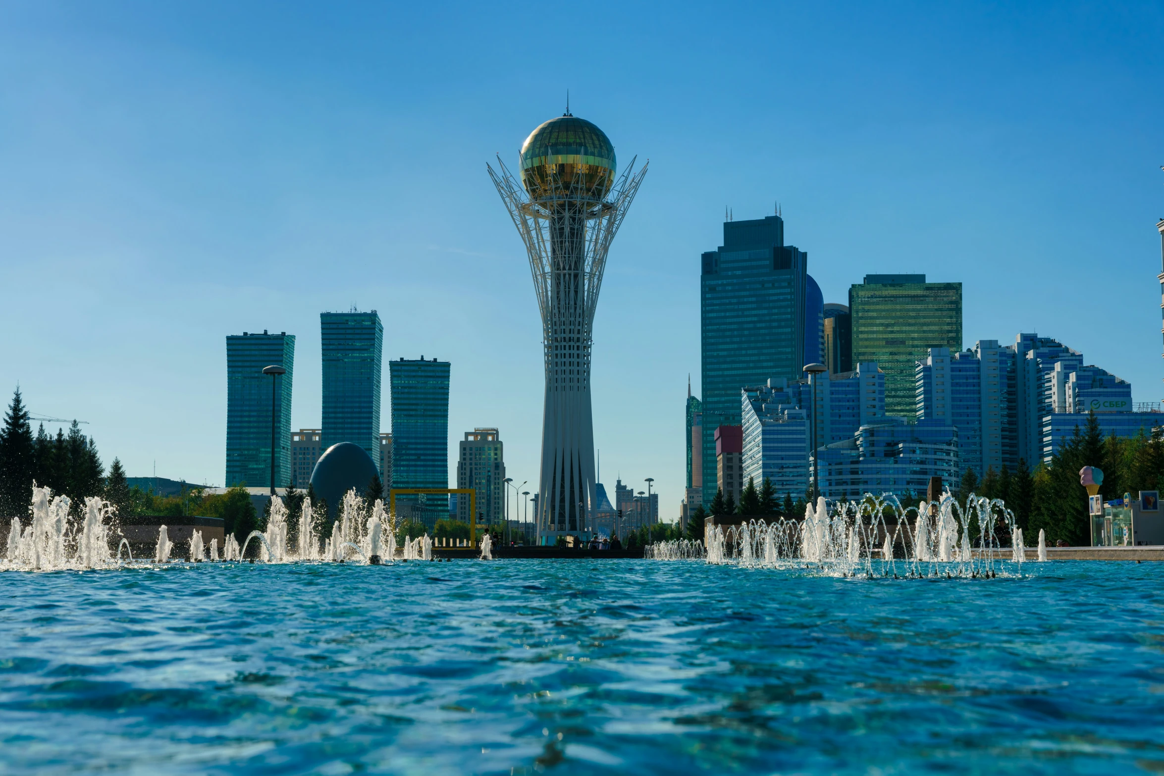 a large body of water in front of a city skyline