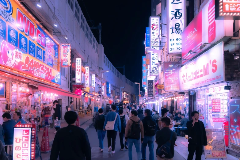 a group of people walk along a shopping area