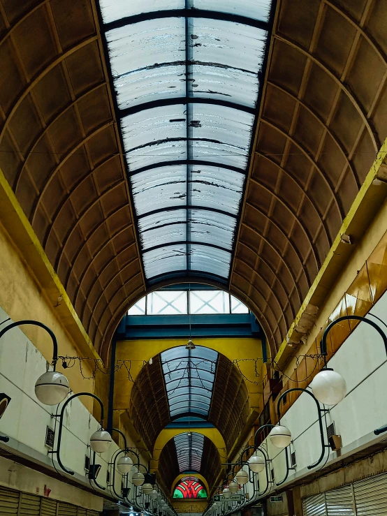 the ceiling of an indoor shopping mall area