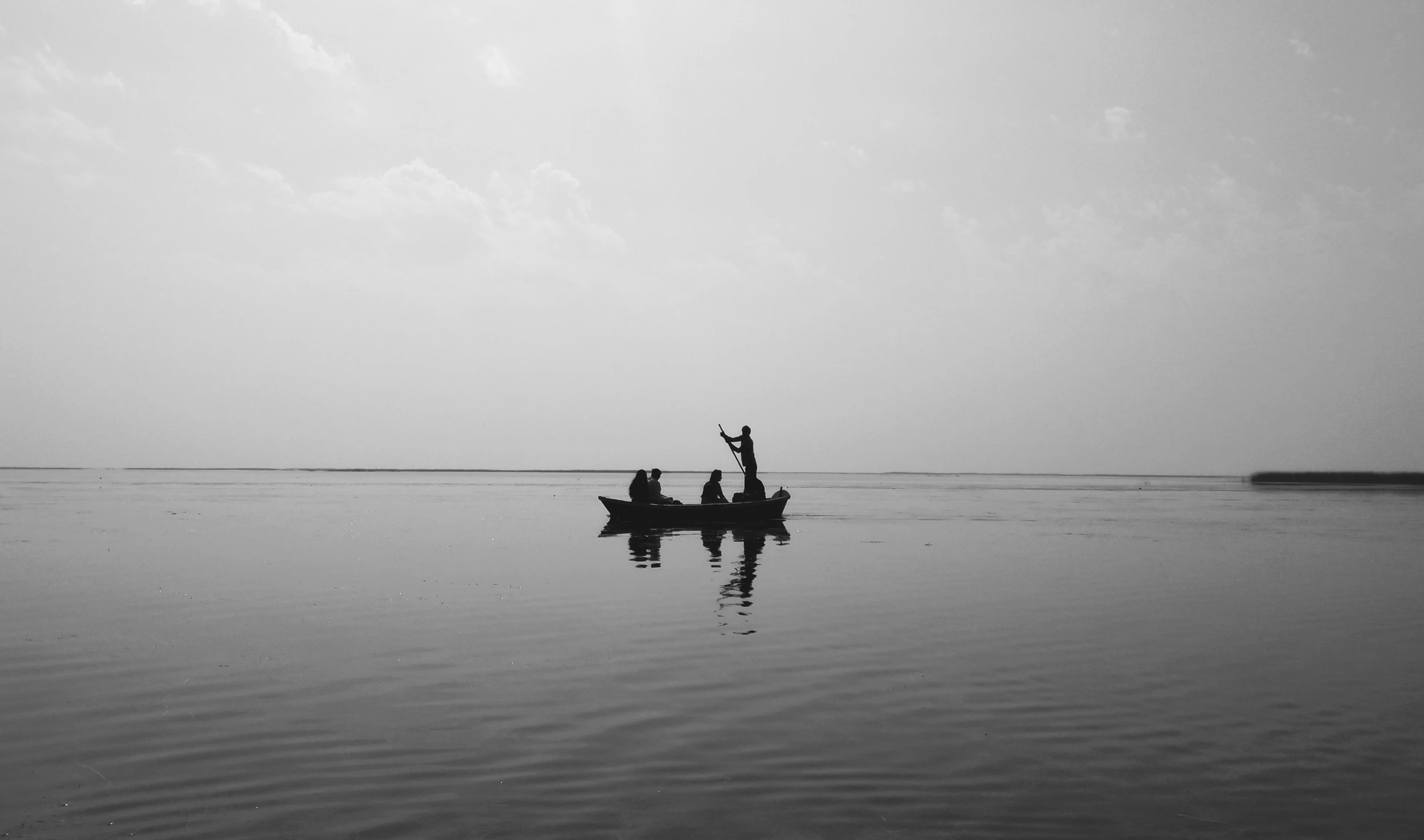 there are two boats in the water with one boat