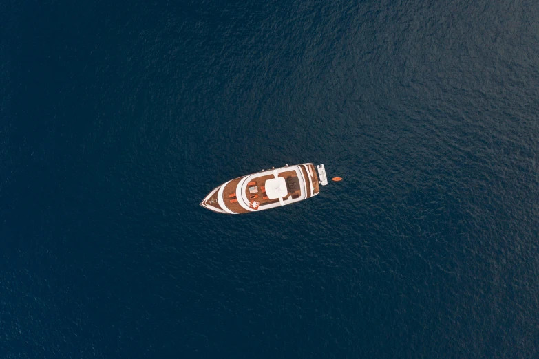 the ship in the water has some red designs on it