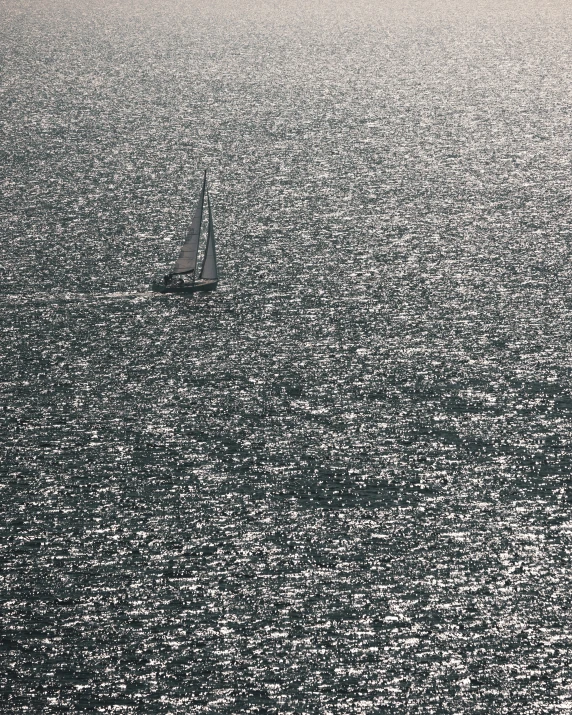 a small boat floating in a large body of water