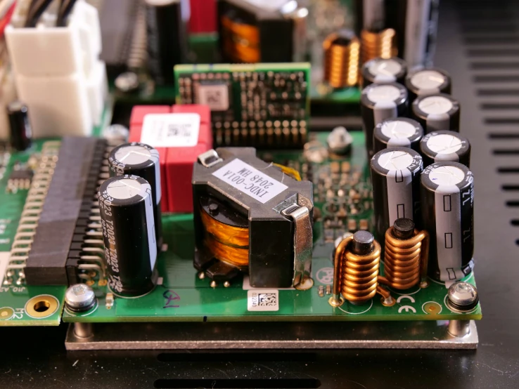 an electronic board with multiple capacitors on it