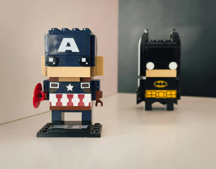 a close up of a toy robot and batman