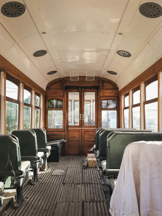 an old fashioned looking bus in a wood - paneled area