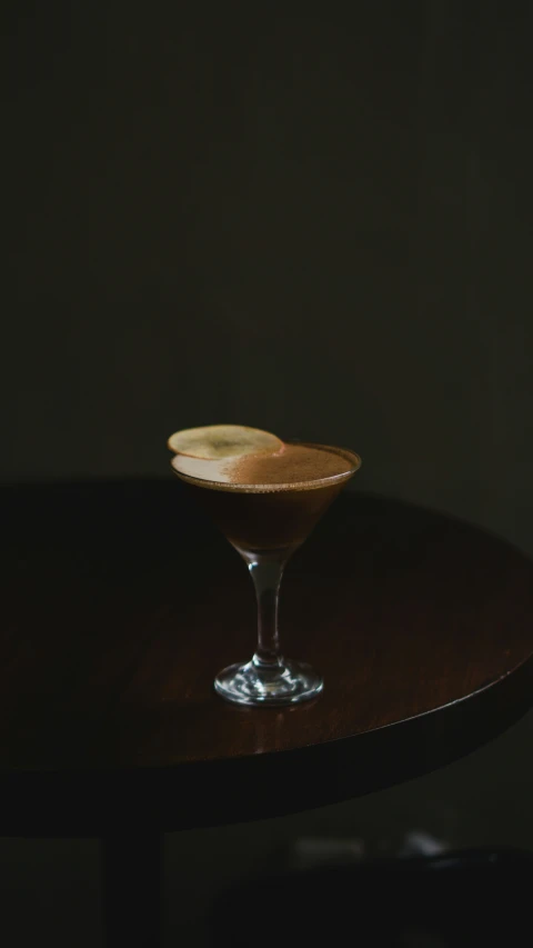 a chocolate martini on a table is displayed