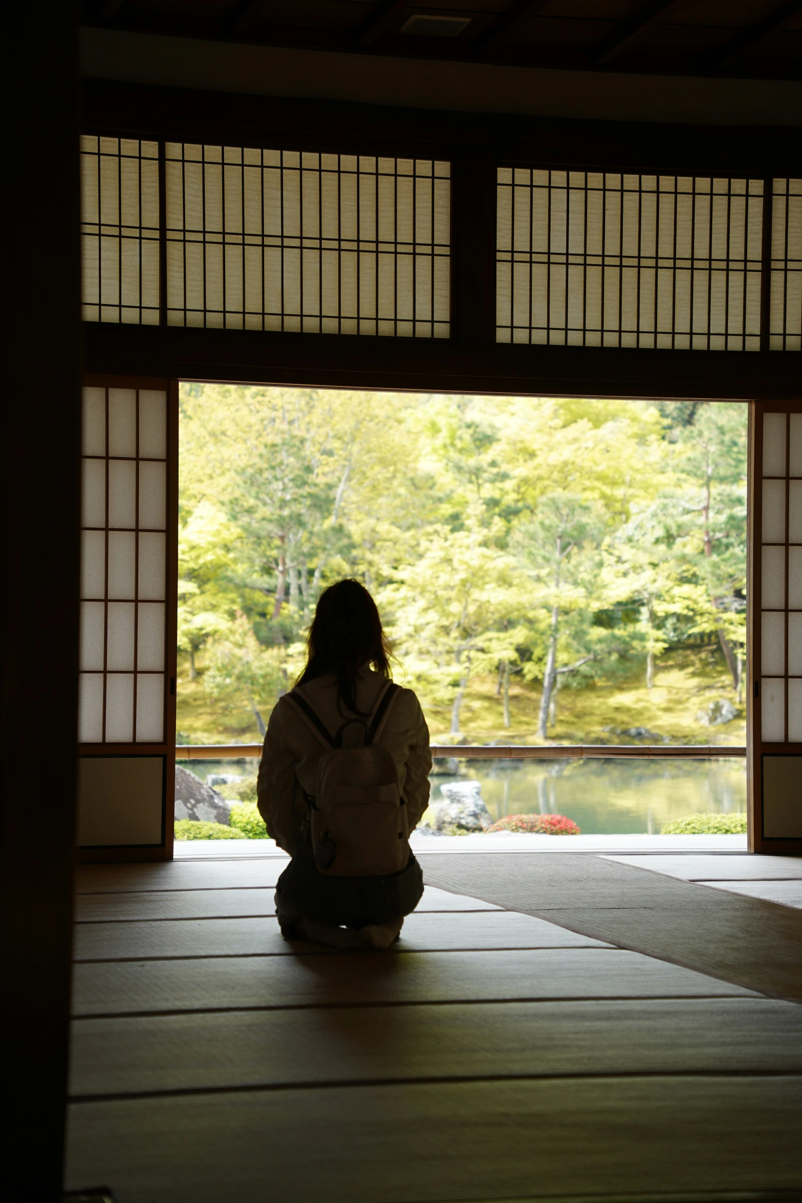 a person in a room with an open doorway