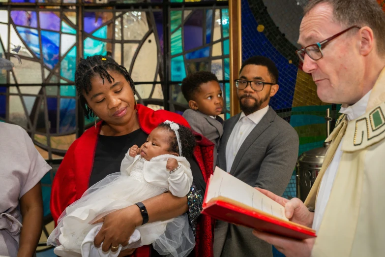 a woman holding a small child in a church