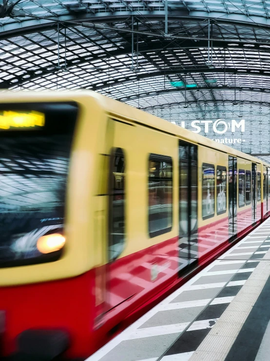 people are waiting for a train to arrive at the station